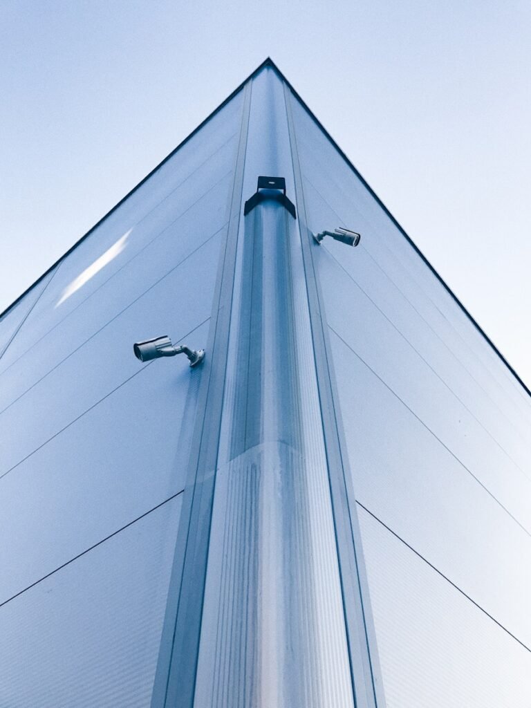 low-angle photo of building with security cameras