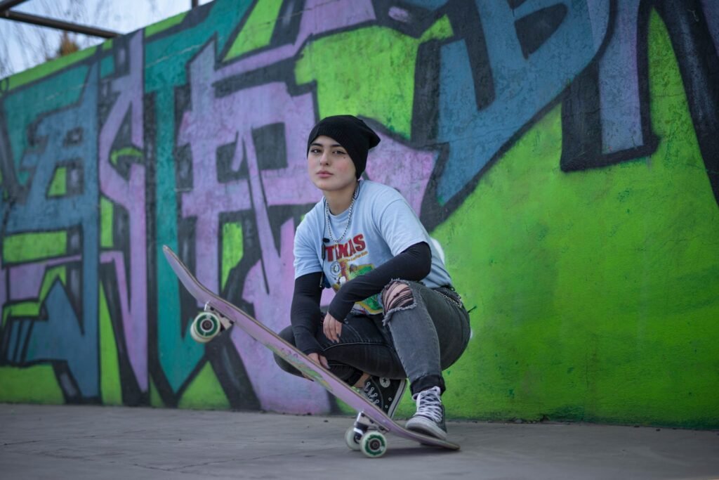 man in white crew neck t-shirt riding on skateboard during daytime